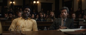 Movie still from “The Trial of the Chicago 7” (2020), directed by Aaron Sorkin – A group of people sitting in a courtroom; Medium shot, Over the shoulder angle