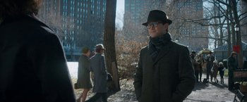 Movie still from “The Trial of the Chicago 7” (2020), directed by Aaron Sorkin – A man wearing a hat and a coat; Medium shot, Over the shoulder angle