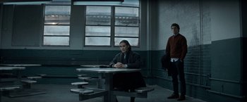 Movie still from “The Trial of the Chicago 7” (2020), directed by Aaron Sorkin – Two people are sitting at a table in a room; Wide shot, Over the shoulder angle