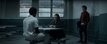 Movie still from “The Trial of the Chicago 7” (2020), directed by Aaron Sorkin – Two people sitting at a table in a room; Wide shot, Over the shoulder angle