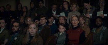 Movie still from “The Trial of the Chicago 7” (2020), directed by Aaron Sorkin – A group of people sitting and standing in a room; Medium shot, Over the shoulder angle