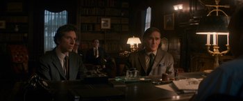 Movie still from “The Trial of the Chicago 7” (2020), directed by Aaron Sorkin – A group of people sitting at a table in a room; Medium shot, Low angle