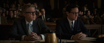 Movie still from “The Trial of the Chicago 7” (2020), directed by Aaron Sorkin – Two men sitting at a table in front of each other; Medium shot, Over the shoulder angle