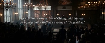 Movie still from “The Trial of the Chicago 7” (2020), directed by Aaron Sorkin – A group of people sitting in front of an audience; Extreme Wide shot, High angle