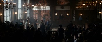 Movie still from “The Trial of the Chicago 7” (2020), directed by Aaron Sorkin – A group of people standing in front of a court room; Extreme Wide shot, High angle