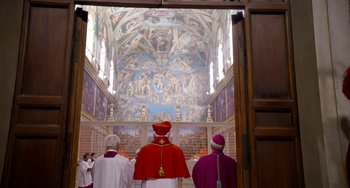 Movie still from “The Two Popes” (2019), directed by Fernando Meirelles – A group of men standing next to each other in front of a painting; Extreme Wide shot, High angle