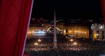 Movie still from “The Two Popes” (2019), directed by Fernando Meirelles – A large crowd of people gathered in a city square; Extreme Wide shot, High angle