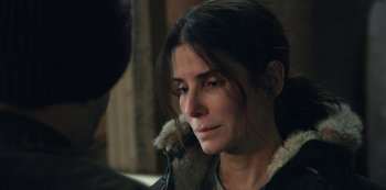 Movie still from “The Unforgivable” (2021), directed by Nora Fingscheidt – A person wearing a jacket; Close Up shot, Over the shoulder angle