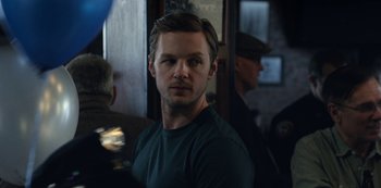 Movie still from “The Unforgivable” (2021), directed by Nora Fingscheidt – A person wearing a green shirt; Close Up shot, Over the shoulder angle