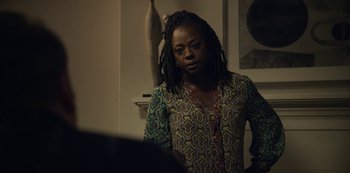 Movie still from “The Unforgivable” (2021), directed by Nora Fingscheidt – A woman with dreadlocks standing in front of a mirror; Medium shot, Over the shoulder angle