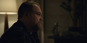 Movie still from “The Unforgivable” (2021), directed by Nora Fingscheidt – A person with a beard; Close Up shot, Over the shoulder angle