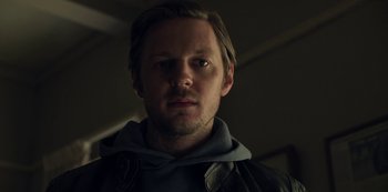 Movie still from “The Unforgivable” (2021), directed by Nora Fingscheidt – A person wearing a jacket; Close Up shot, Low angle