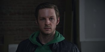 Movie still from “The Unforgivable” (2021), directed by Nora Fingscheidt – A person wearing a jacket; Close Up shot, Over the shoulder angle