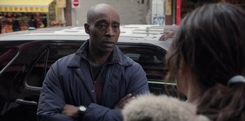Movie still from “The Unforgivable” (2021), directed by Nora Fingscheidt – A man standing next to a woman in front of a car; Close Up shot, Over the shoulder angle