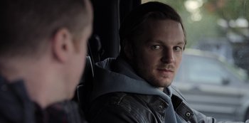 Movie still from “The Unforgivable” (2021), directed by Nora Fingscheidt – A person in a car looking at the camera; Close Up shot, Over the shoulder angle