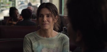 Movie still from “The Unforgivable” (2021), directed by Nora Fingscheidt – A woman sitting in front of another person; Close Up shot, Over the shoulder angle