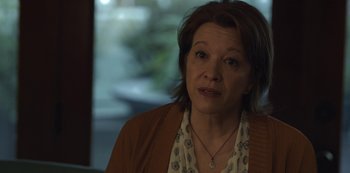 Movie still from “The Unforgivable” (2021), directed by Nora Fingscheidt – A person wearing a sweater; Close Up shot, Over the shoulder angle