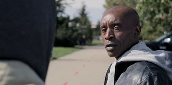 Movie still from “The Unforgivable” (2021), directed by Nora Fingscheidt – A person standing on the side of a road; Close Up shot, Low angle