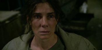 Movie still from “The Unforgivable” (2021), directed by Nora Fingscheidt – A person wearing a green shirt; Close Up shot, High angle