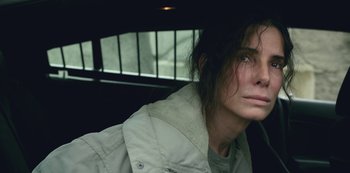 Movie still from “The Unforgivable” (2021), directed by Nora Fingscheidt – A woman with long hair is sitting in a car; Close Up shot, High angle