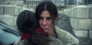 Movie still from “The Unforgivable” (2021), directed by Nora Fingscheidt – A woman is crying while hugging another woman; Close Up shot, High angle