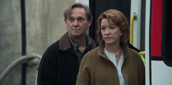 Movie still from “The Unforgivable” (2021), directed by Nora Fingscheidt – A man and a woman standing next to each other; Medium shot, Over the shoulder angle