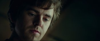 Movie still from “The Vault” (2021), directed by Jaume Balagueró – A young man's face; Close Up shot, Low angle