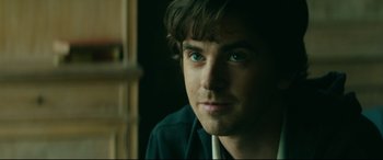 Movie still from “The Vault” (2021), directed by Jaume Balagueró – A person wearing a jacket; Close Up shot, Over the shoulder angle