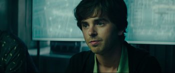 Movie still from “The Vault” (2021), directed by Jaume Balagueró – A person wearing a jacket; Close Up shot, Over the shoulder angle