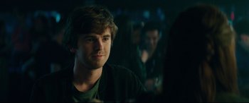 Movie still from “The Vault” (2021), directed by Jaume Balagueró – A young man is looking into the distance; Close Up shot, Over the shoulder angle