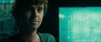 Movie still from “The Vault” (2021), directed by Jaume Balagueró – A man's face in front of a window; Close Up shot, Over the shoulder angle