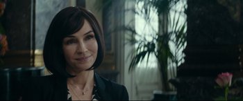 Movie still from “The Vault” (2021), directed by Jaume Balagueró – A person wearing a suit; Close Up shot, Over the shoulder angle