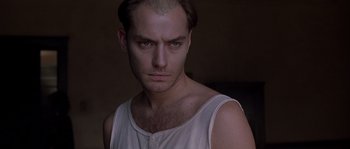 Movie still from “Road to Perdition” (2002), directed by Sam Mendes – A person wearing a white shirt; Close Up shot, High angle