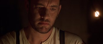 Movie still from “Road to Perdition” (2002), directed by Sam Mendes – A man's face in the dark; Close Up shot, Low angle