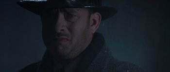 Movie still from “Road to Perdition” (2002), directed by Sam Mendes – A person wearing a hat; Close Up shot, Low angle