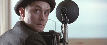 Movie still from “Road to Perdition” (2002), directed by Sam Mendes – A person wearing a hat; Close Up shot, Low angle