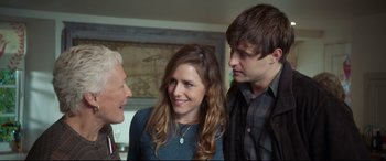 Movie still from “The Wife” (2017), directed by Björn Runge – Two men and a woman standing next to each other in a room; Close Up shot, Over the shoulder angle