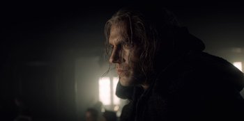 Movie still from “The Witcher” (2019), created by Lauren Schmidt Hissrich – A person with long white hair; Close Up shot, Low angle