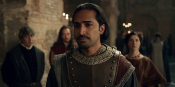 Movie still from “The Witcher” (2019), created by Lauren Schmidt Hissrich – A person wearing a suit of armor; Close Up shot, Over the shoulder angle