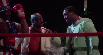 Movie still from “Rocky” (1976), directed by John G. Avildsen – A couple of men standing next to each other in a boxing ring; Medium shot, Low angle