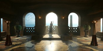 Movie still from “The Witcher” (2019), created by Lauren Schmidt Hissrich – A person sitting on a bench looking out at the ocean; Extreme Wide shot, Low angle