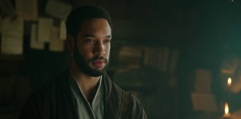 Movie still from “The Witcher” (2019), created by Lauren Schmidt Hissrich – A man with a beard is looking into the distance; Close Up shot, High angle