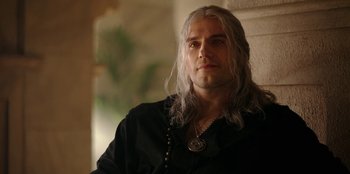 Movie still from “The Witcher” (2019), created by Lauren Schmidt Hissrich – A person with long white hair; Close Up shot, Over the shoulder angle