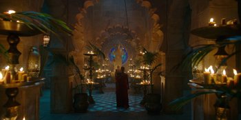 Movie still from “The Witcher” (2019), created by Lauren Schmidt Hissrich – A man standing in front of candles in a room; Extreme Wide shot, Low angle