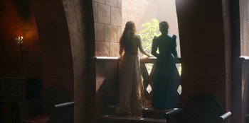 Movie still from “The Witcher” (2019), created by Lauren Schmidt Hissrich – Two women are standing at the top of a staircase; Wide shot, Low angle