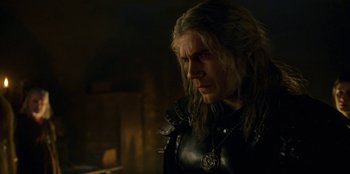 Movie still from “The Witcher” (2019), created by Lauren Schmidt Hissrich – A person wearing a black outfit; Close Up shot, Over the shoulder angle