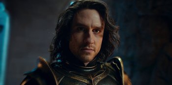 Movie still from “The Witcher” (2019), created by Lauren Schmidt Hissrich – A person with long hair; Close Up shot, Low angle