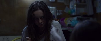 Movie still from “Room” (2015), directed by Lenny Abrahamson – A woman is sitting in a room with a cat in her hand; Close Up shot, Over the shoulder angle