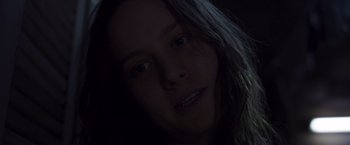 Movie still from “Room” (2015), directed by Lenny Abrahamson – A woman's face in the dark; Close Up shot, Low angle