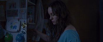 Movie still from “Room” (2015), directed by Lenny Abrahamson – A woman is looking into a refrigerator at night; Close Up shot, Over the shoulder angle